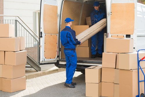 Professional movers from Watson Removals assisting with a home move.