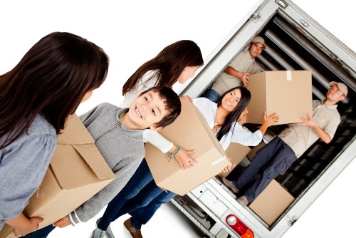 Professional movers handling household items in Sidcup