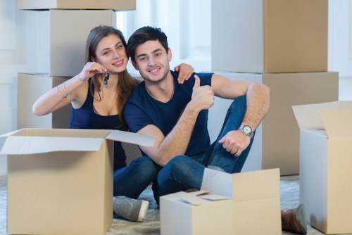 Professional movers assisting with a household move in Brentford