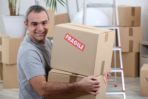 Professional movers handling furniture in Ponders End
