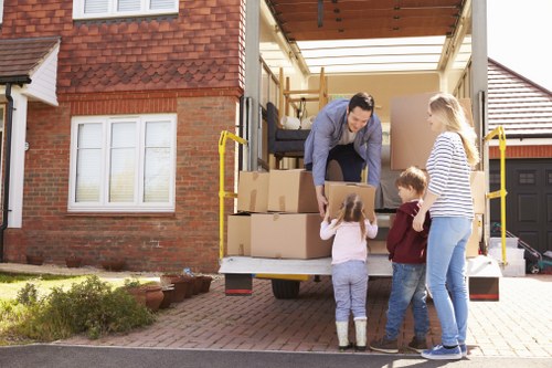 Professional house movers handling furniture at Watson Removals